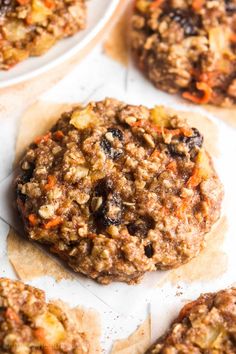 an oatmeal cookie with raisins and carrots on top