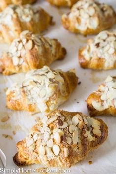 almond croissants are sitting on a baking sheet and ready to be eaten