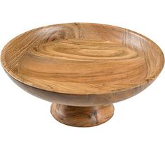 a wooden bowl sitting on top of a white surface with wood grain in the center