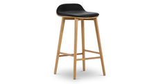 a black stool with wooden legs and a seat on the bottom, in front of a white background