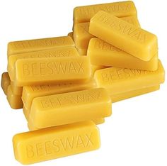 beeswax bar soaps are stacked on top of each other with the words beeswax printed on them