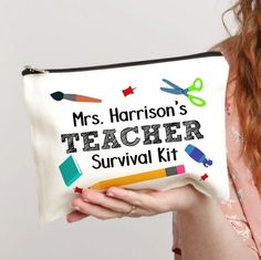 a woman holding a personalized teacher survival kit