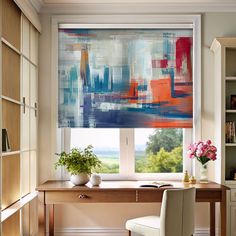 a desk and chair in front of a window with an abstract painting on the wall