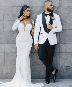 a man in a tuxedo standing next to a woman in a wedding dress