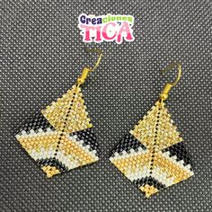 the earrings are made out of beads and beaded with yellow, black and white squares