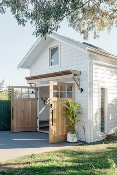 a small white house with a wooden door