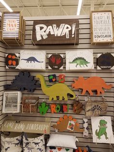 there are many dinosaur signs on the wall