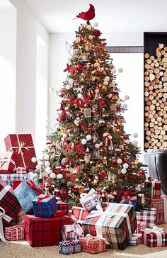 a decorated christmas tree with presents under it