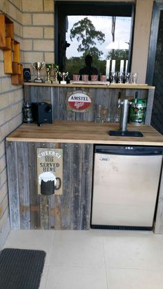 a kitchen area with a sink, dishwasher and stove top oven in it