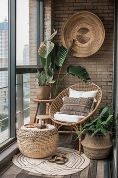 a balcony with wicker furniture and potted plants on the floor, along with large windows