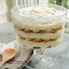 a layered dessert in a glass dish on a table