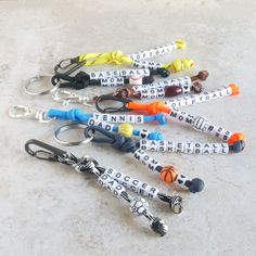 several different key chains with name tags on them