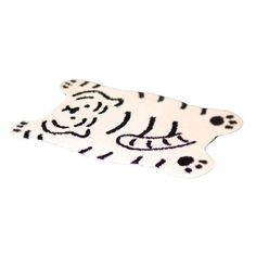 a white tiger rug with black spots on it