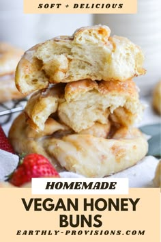 homemade vegan honey buns stacked on top of each other with strawberries in the background