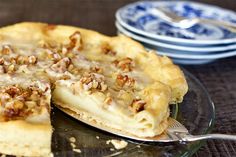 a close up of a pie on a plate with a slice taken out of it