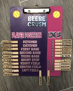 a purple plaque with some wooden sticks in front of it that says beebe crush player position