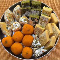 a plate full of different types of pastries