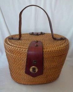 Inside is fully lined with an open slip pocket. 1960s Handbags, Vintage Exercise, Basket Handbag, Old Wicker, Historic Fashion, Large Makeup Bag, Vintage Memory, Straw Bags, Etienne Aigner