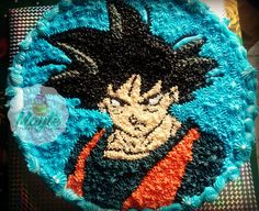 a birthday cake decorated with an image of the character gohan from dragon ball on it