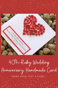 a red and white card with buttons on it that says forty ruby wedding anniversary handmade card