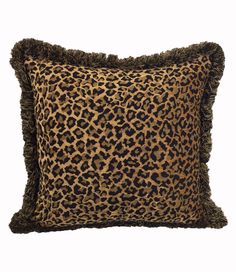 a leopard print pillow with fringes on the front and back, sitting on a white background