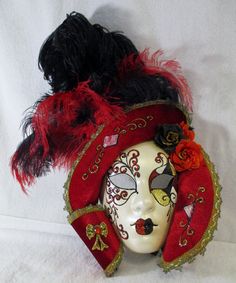 "Large La Maschera Del Galeone Red and Black Feathered Wall Mask Hand made in Venice, Italy. With original tags. Measures approximately 18.00\" tall, 16.00\" wide and extends 4.00\" from the wall. Feel free to make a reasonable offer on this or any of my items throughout my shop. Local area delivery is available for this item, please inquire about cost." Red Full Face Mask For Carnival, Luxury Red Masquerade Mask For Carnival, Red Cosplay Mask For Carnival, Full Face Red Mask For Cosplay, Luxury Red Theater Mask, Wall Mask, Feather Wall, Black Feathers, Halloween Face Makeup