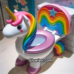 a toy toilet with a rainbow unicorn seat