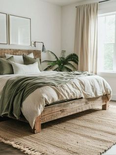 a large bed sitting next to a window in a bedroom on top of a rug