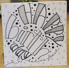 a card with black and white designs on it