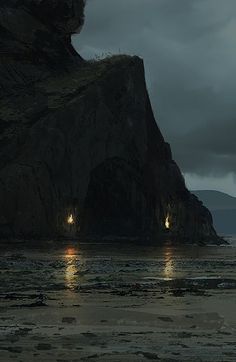 two people walking on the beach at night