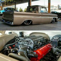 an old truck is shown with the engine in it's bed and another car parked next to it