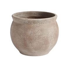 a large gray pot sitting on top of a white surface