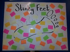 a sign with post it notes on it that says, stinky feet boooo