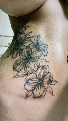 a woman's back with flowers on it