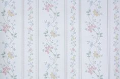 a wallpaper with flowers and stripes in pastel blue, pink, yellow and green