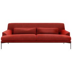 a red couch sitting on top of a white floor