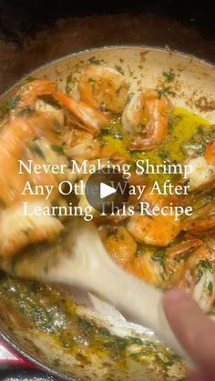 someone is cooking shrimp in a pot on the stove