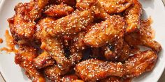 chicken wings with sesame seeds on a white plate