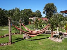 a hammock hanging in the middle of a yard