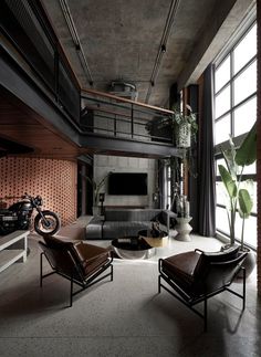 a living room filled with furniture and a motorcycle