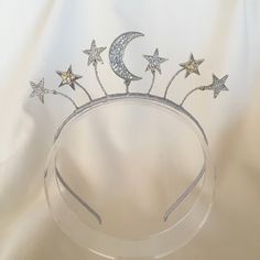 Drawing inspiration from all things celestial, the Star Collection is both whimsical and striking. The galactic trend is a versatile look perfect for a wide range of occasions. A fun and cute little boho tiara featuring the moon and stars hand wired onto a satin wrapped band. To shop more items from the Star Collection: https://www.etsy.com/au/shop/MerineDesigns?ref=simple-shop-header-name&listing_id=711775814&section_id=26869808 Boho Tiara, Jewel Drawing, Starfish Ring, The Moon And Stars, Luna Moon, Star Headband, Hair Wreaths, Boho Headband, Wedding Tiara