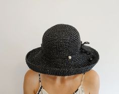 Black Boater Hat With Short Brim For Beach Season, Black Short Brim Boater Hat For Beach Season, Black Boater Hat With Wide Brim For Beach Season, Black Boater Hat With Curved Brim For Beach Season, Black Brimmed Sun Hat For Spring, Black Wide Brim Boater Hat For Beach, Black Wide Brim Boater Hat For Beach Season, Black Cloche Hat For Beach In Spring, Elegant Black Hats For Beach Season