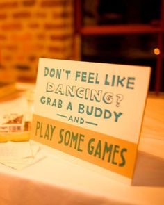 a sign that says don't feel like dancing grab a buddy and play some games