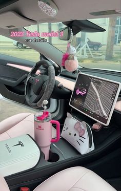 the interior of a car with hello kitty accessories