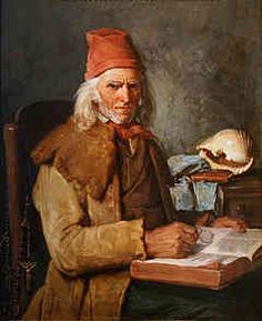 an old man sitting at a desk with a book in front of him and a skull on the table