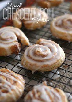 cinnamon roll cookies on a cooling rack with icing