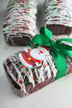 chocolate covered candy wrapped in green ribbon and decorated with santa clause