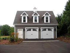 two story garage with three windows on each side