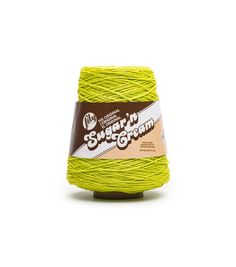 a ball of green yarn with the words sugar it cream written on it in brown and white