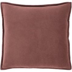 a brown pillow on a white background